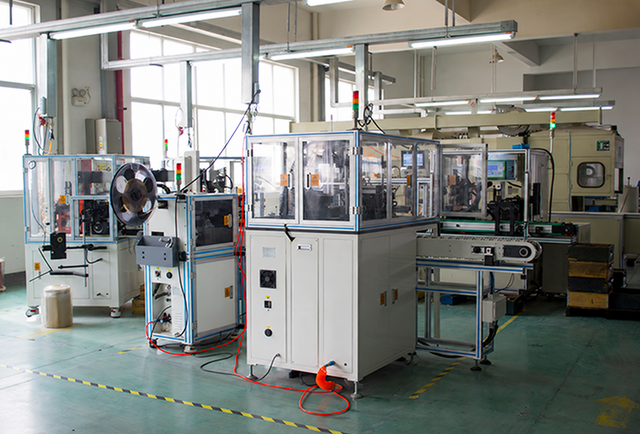 Enclosed automated production machines in a workshop